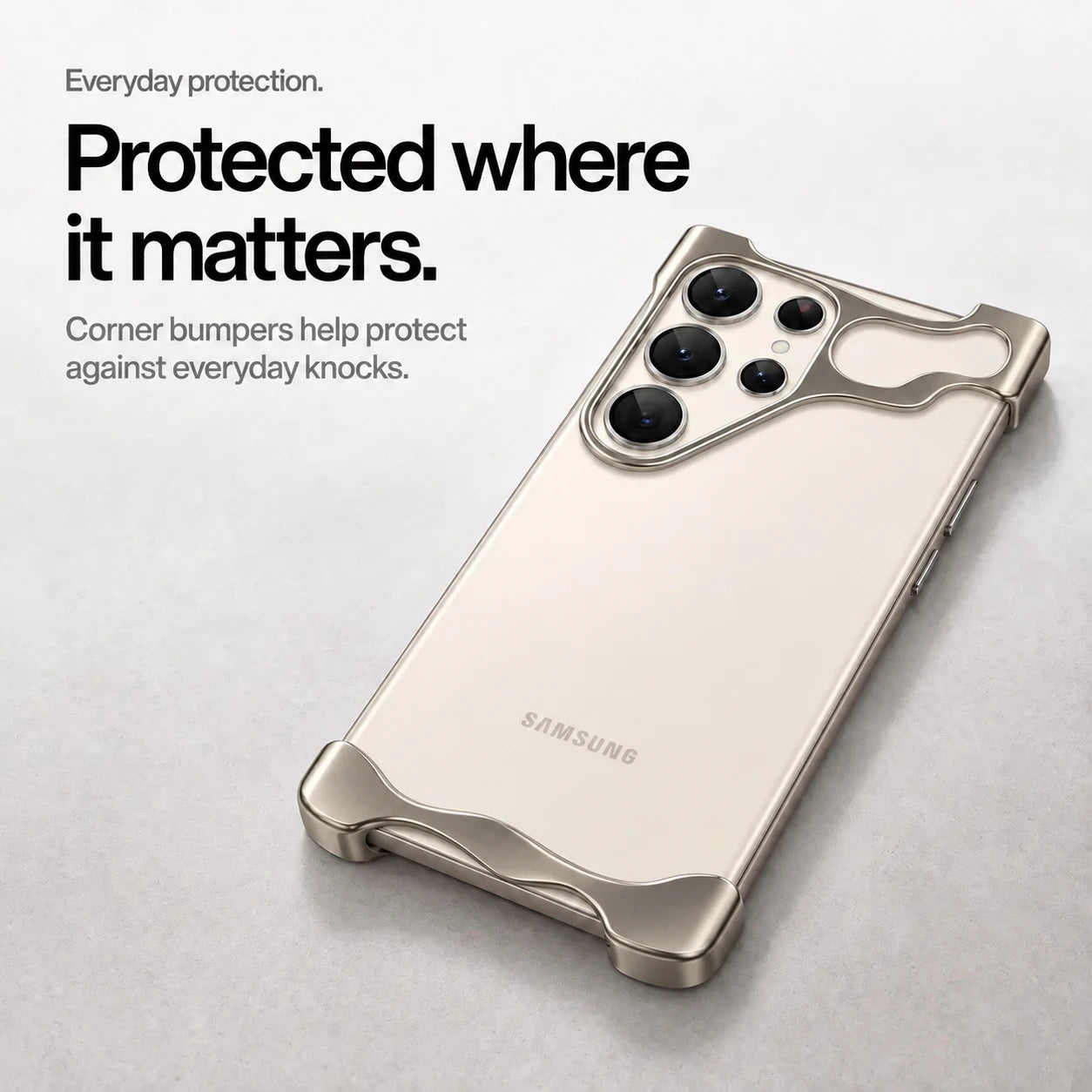 Gray open metal phone bumper case lying on a desk with raised corner protection #color_Gray