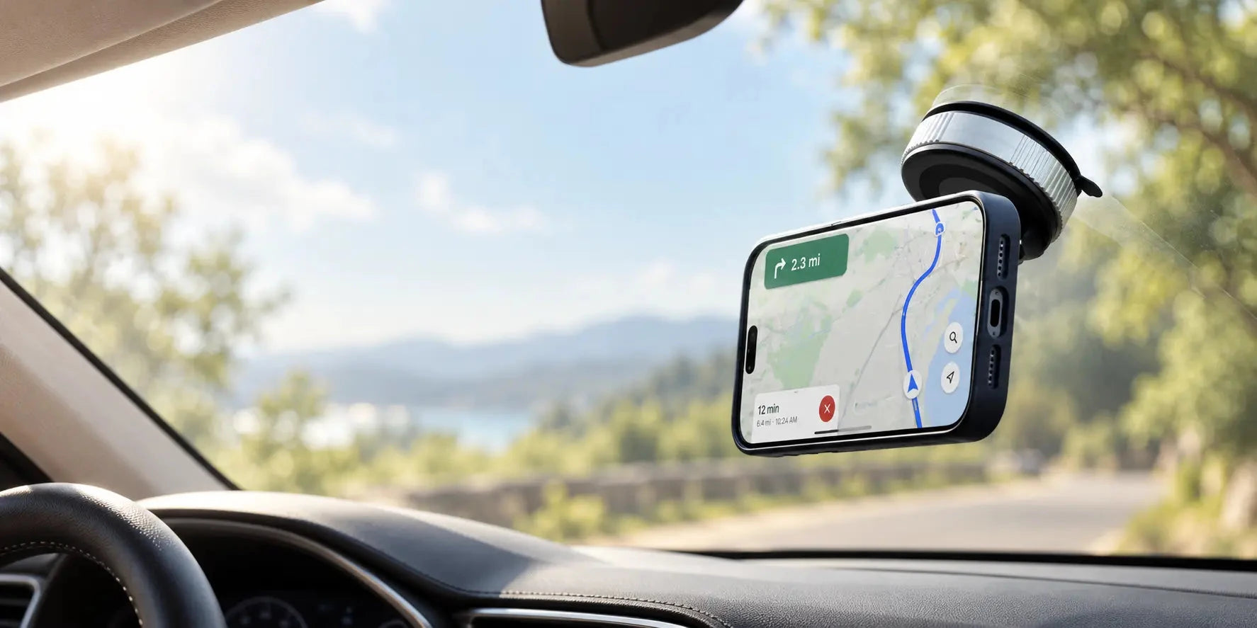 Black magnetic suction phone holder on a car windshield with a phone displaying navigation.