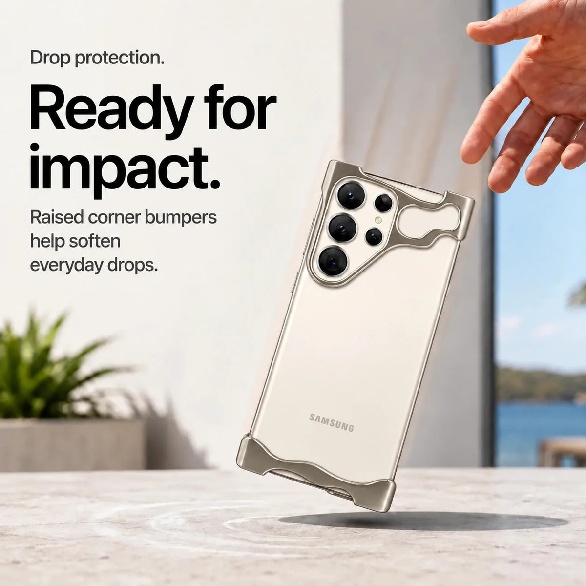 Gray open metal phone bumper case shown above a desk in a drop protection scene #color_Gray